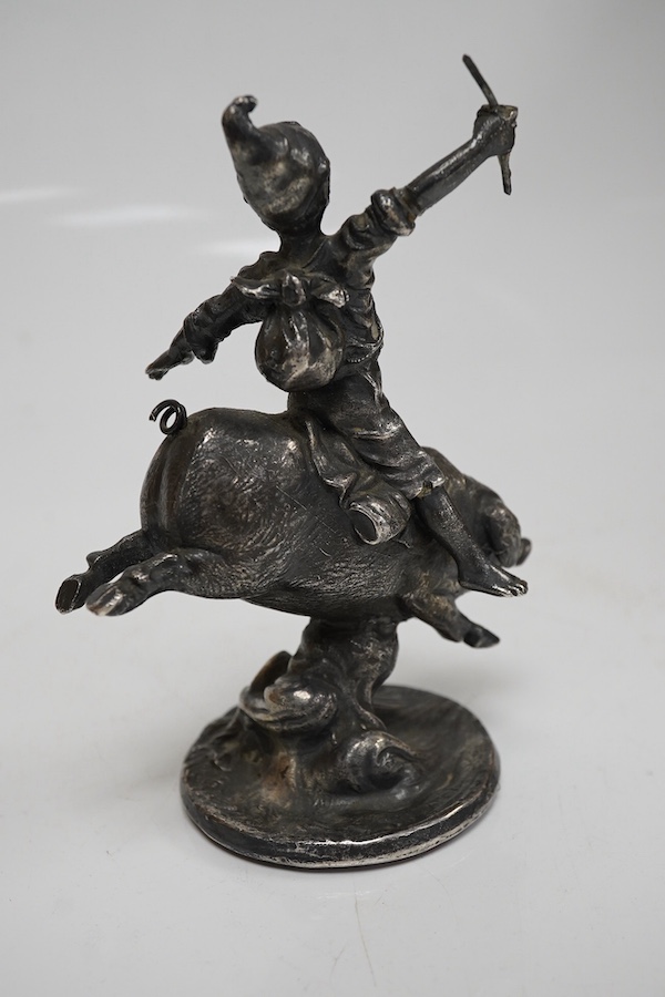 An early 20th century car mascot designed by Franz Bergmann ‘Boy riding a pig’, 12.5cm high. Condition - good, missing a small section in the right hand